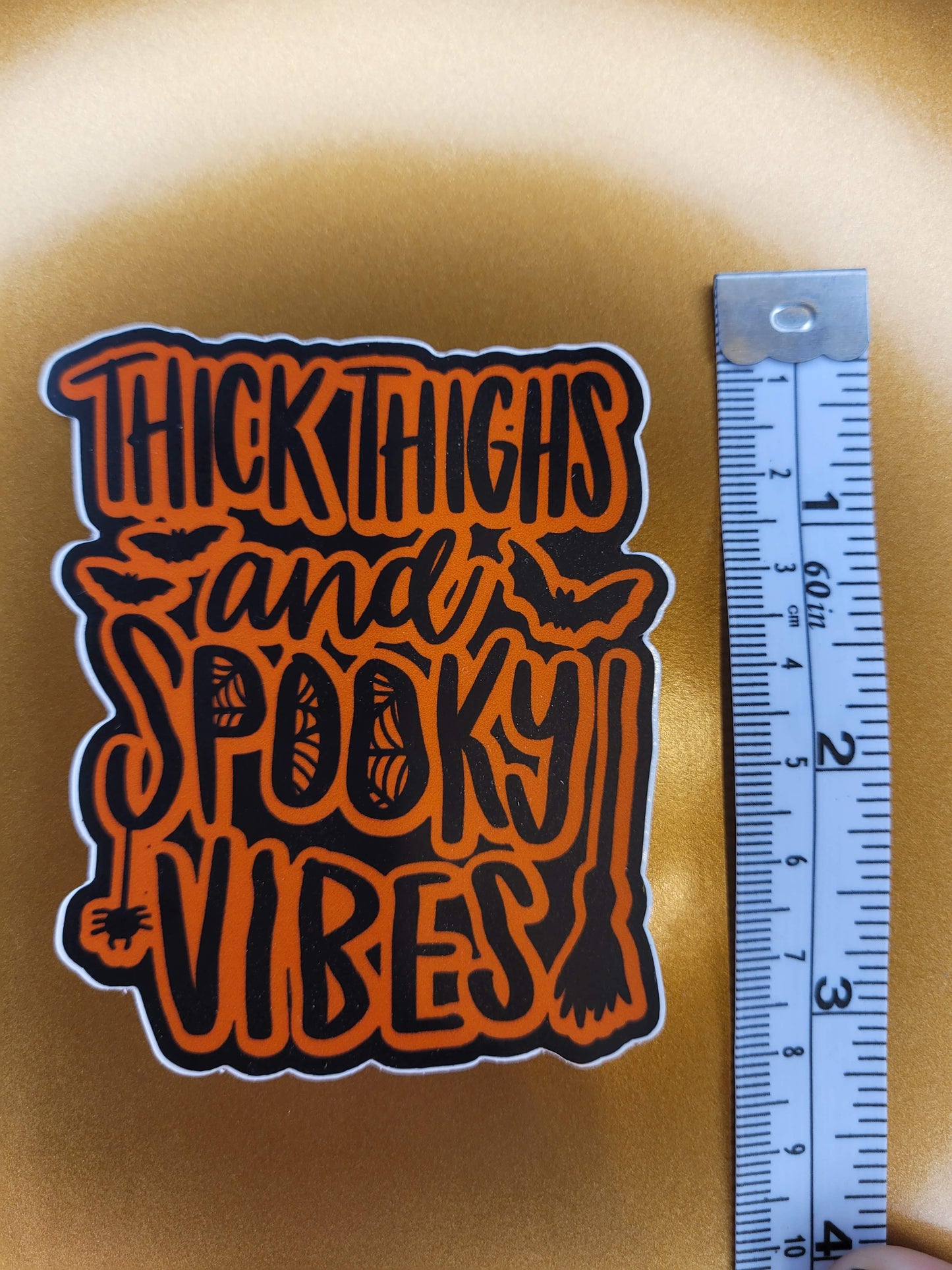 Thick Thighs and Spooky Vibes Sticker